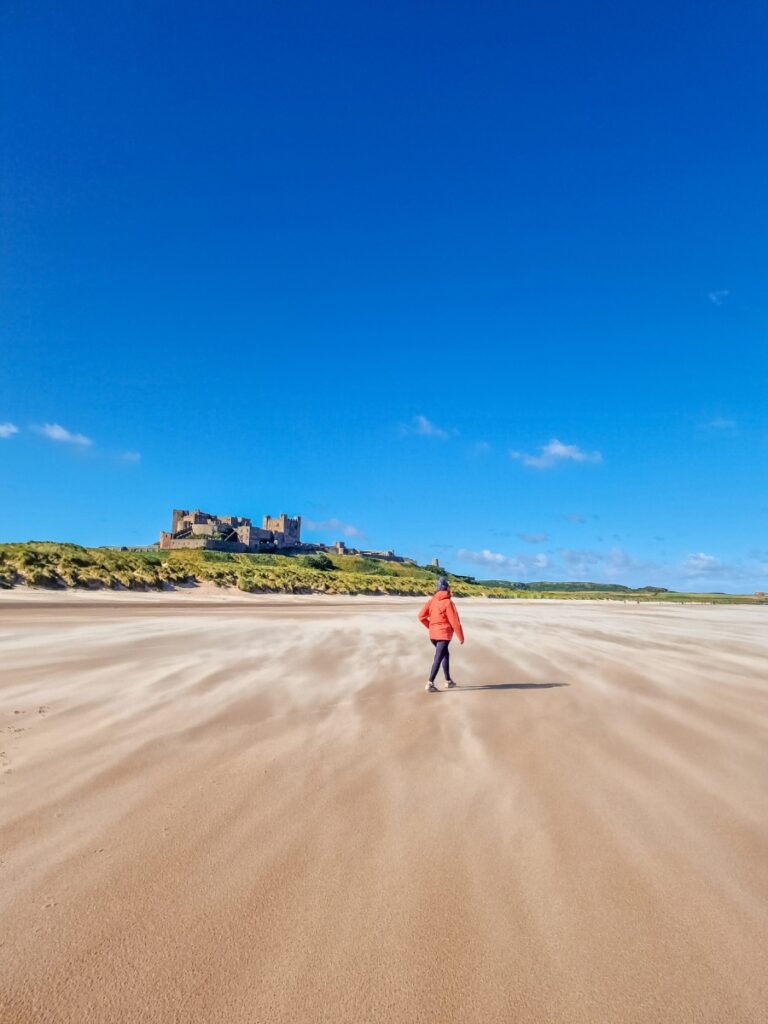 bamburg castle from the beach in northumberland