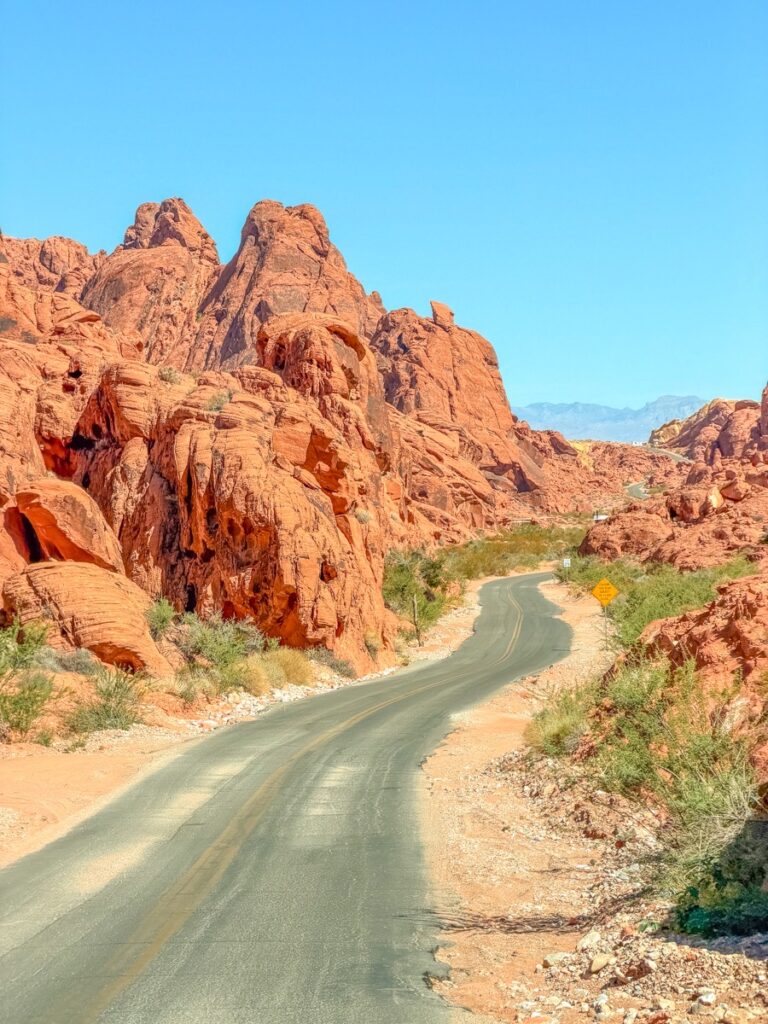 Mouse's Tank Road winding between red rock formations in the Valley of Fire